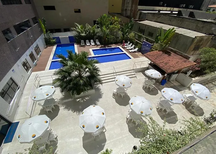 Flat em Pitangueiras - sacada gourmet, 3 dorms, limpeza diária e serv de praia Apartamento Guarujá